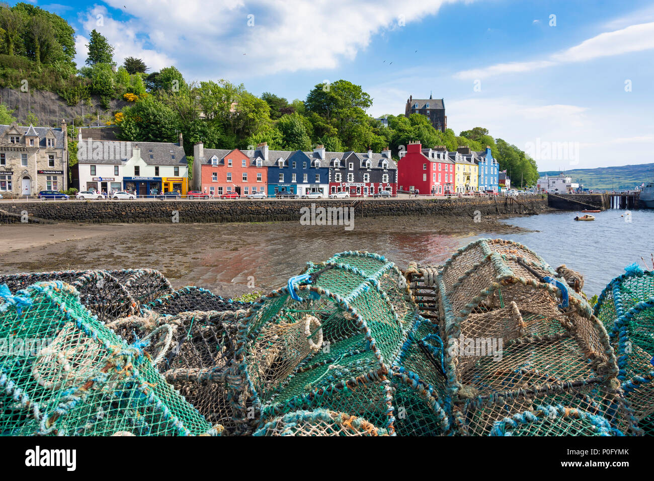 Colourful houses and lobster pots on quayside, Tobermory, Isle of Mull, Inner Hebrides, Argyll and Bute, Scotland, United Kingdom Stock Photo
