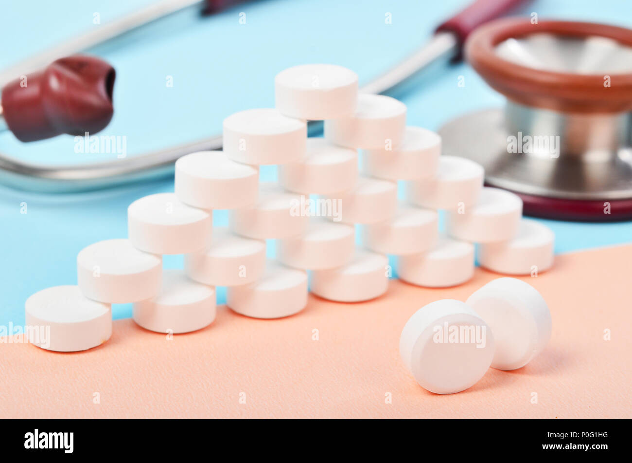 White tablet medicine with medicine stethoscope on blue background ...