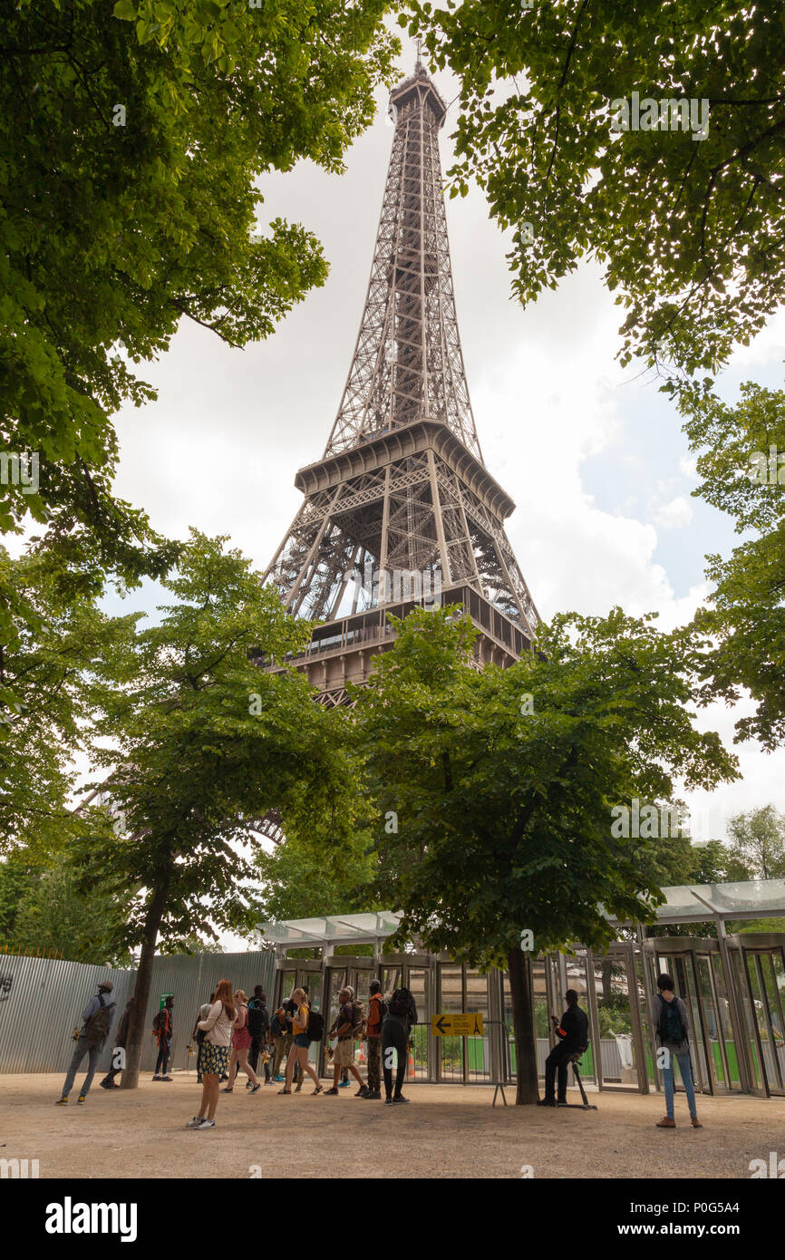 Souvenir sellers or Hawkers gathered around the exit for the Eiffel