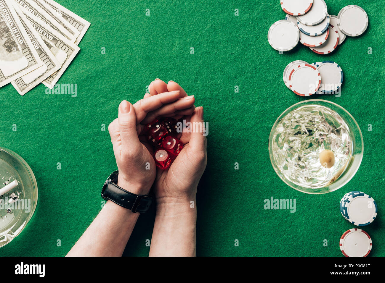 Woman playing dice game by casino table with money and chips Stock ...