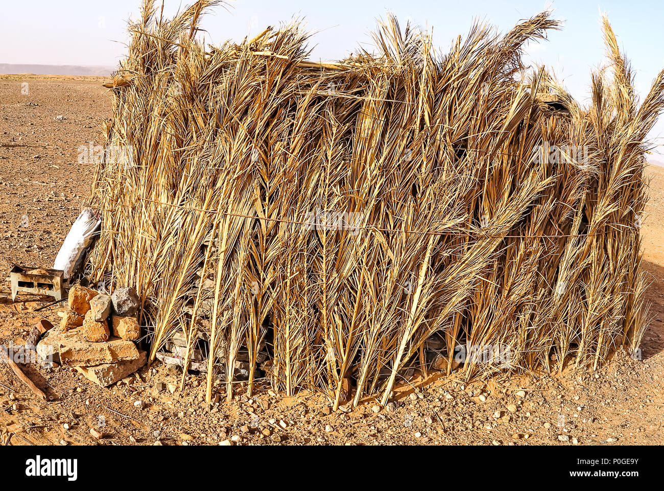 Thatched Bedouin hut in Moroccan desert Stock Photo