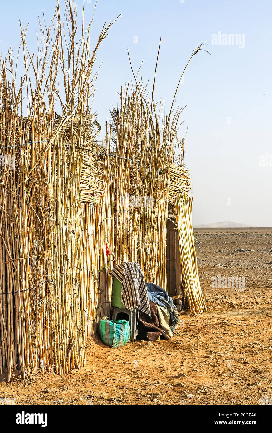 Thatched Bedouin hut in Moroccan desert Stock Photo