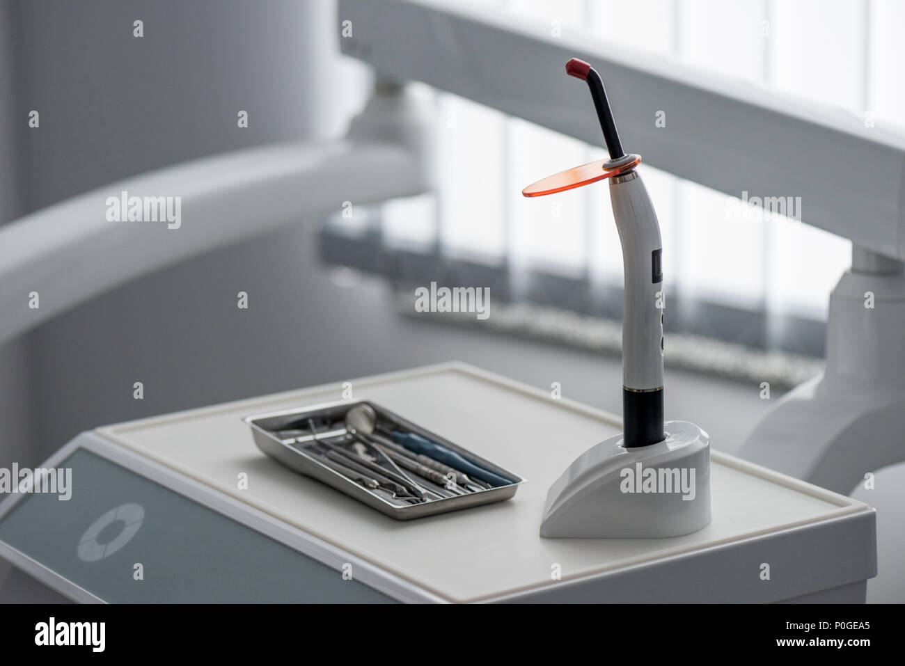 dental curing light and other equipment in dentist office Stock Photo