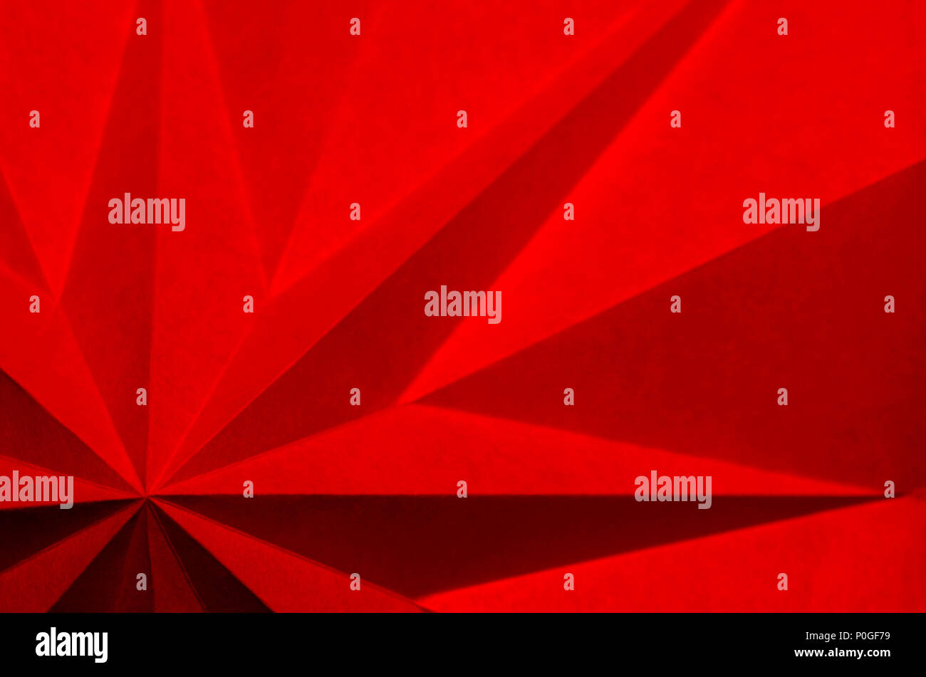 Red origami Christmas holiday abstract background wallpaper Stock Photo