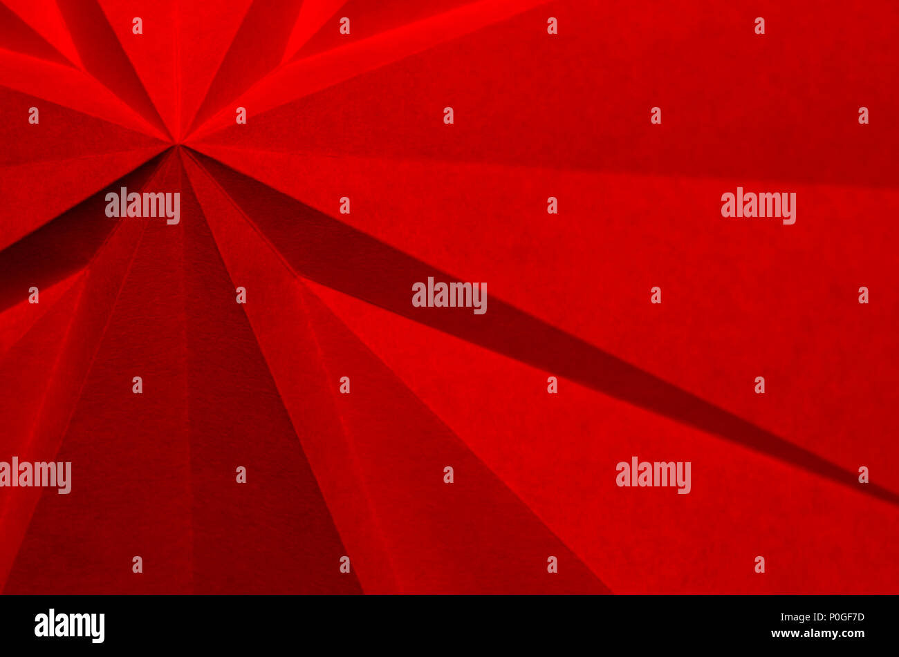 Red origami Christmas holiday abstract background wallpaper Stock Photo