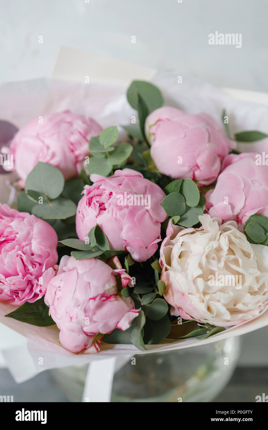 Lovely flowers in glass vase. Beautiful bouquet of pink peonies ...