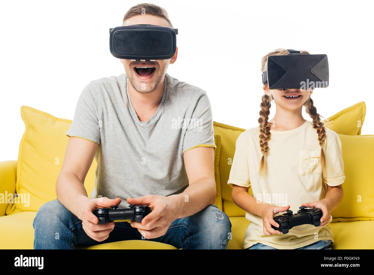 family with joysticks in virtual reality headsets playing video game