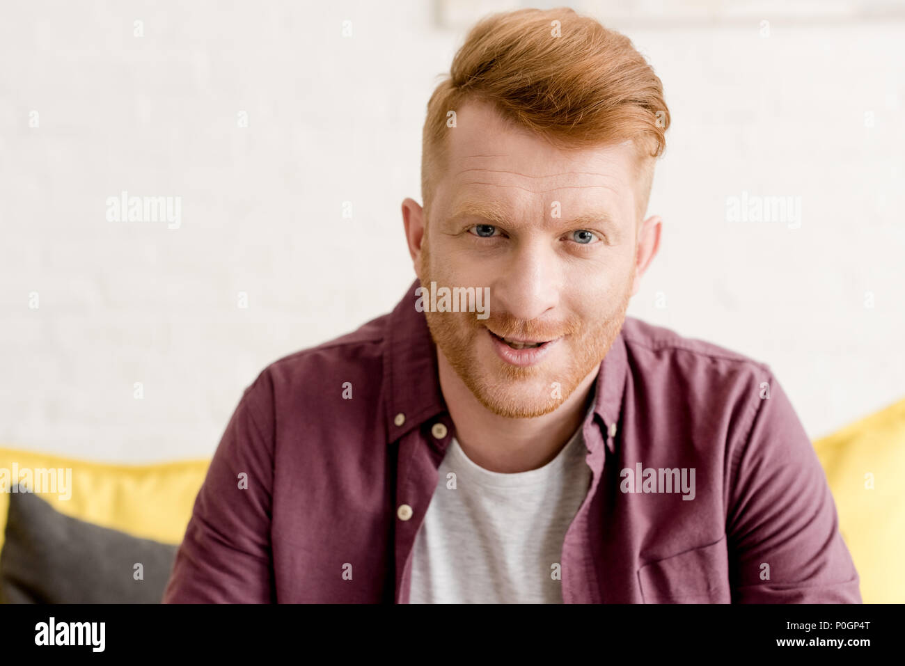portrait of handsome young redhead man smiling at camera Stock Photo ...