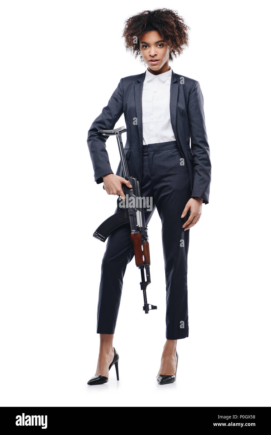 african american female spy in suit with rifle, isolated on white Stock Photo