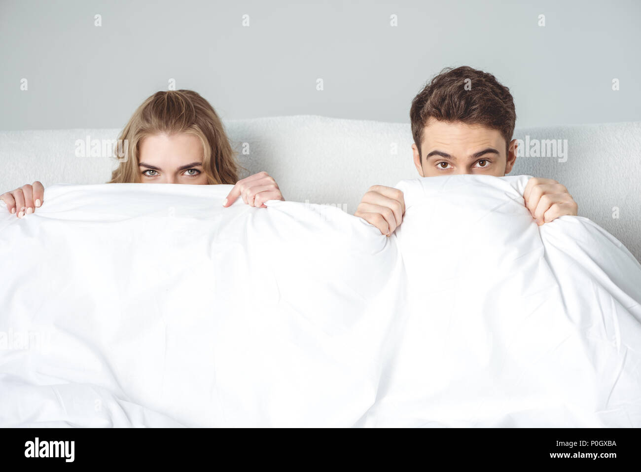 Couple bed hiding hires stock photography and images Alamy