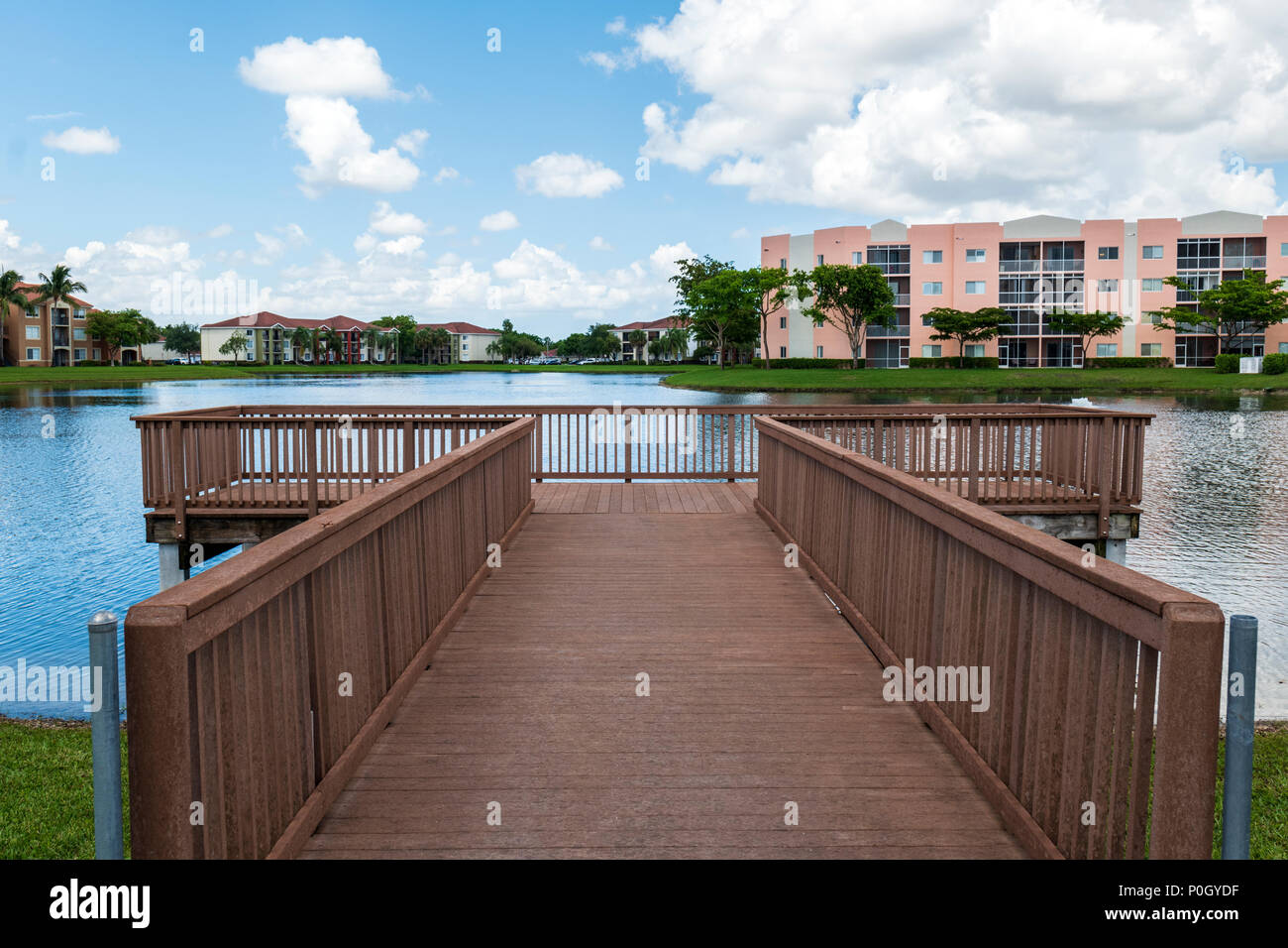 Dock - pier on lake; residential community; south central Florida; USA Stock Photo