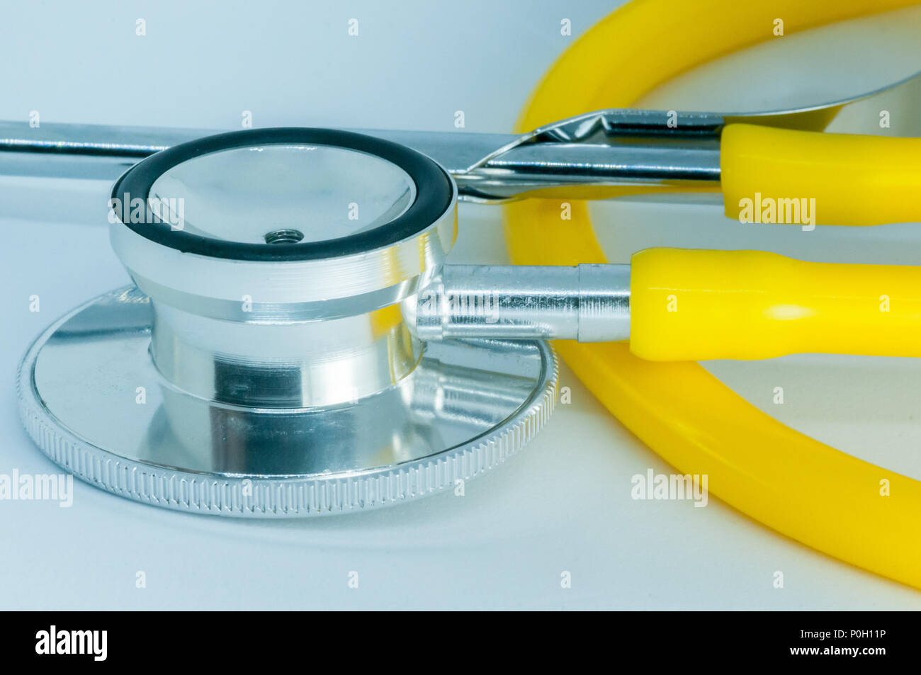 Yellow Stethoscope on white background Stock Photo Alamy
