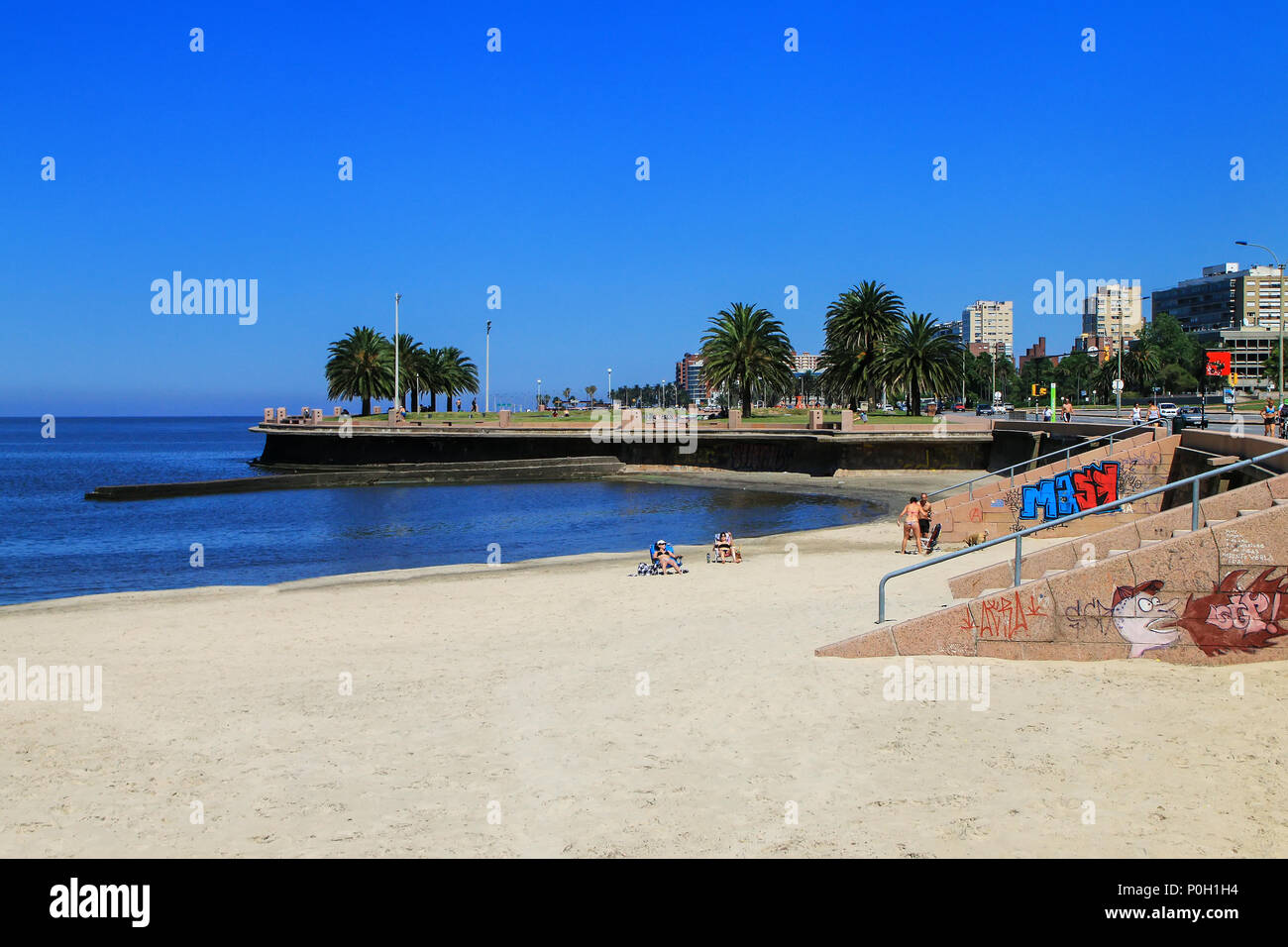 Sandy beach along the bank of the Rio de la Plata in Montevideo, Uruguay. Montevideo is the capital and the largest city of Uruguay Stock Photo