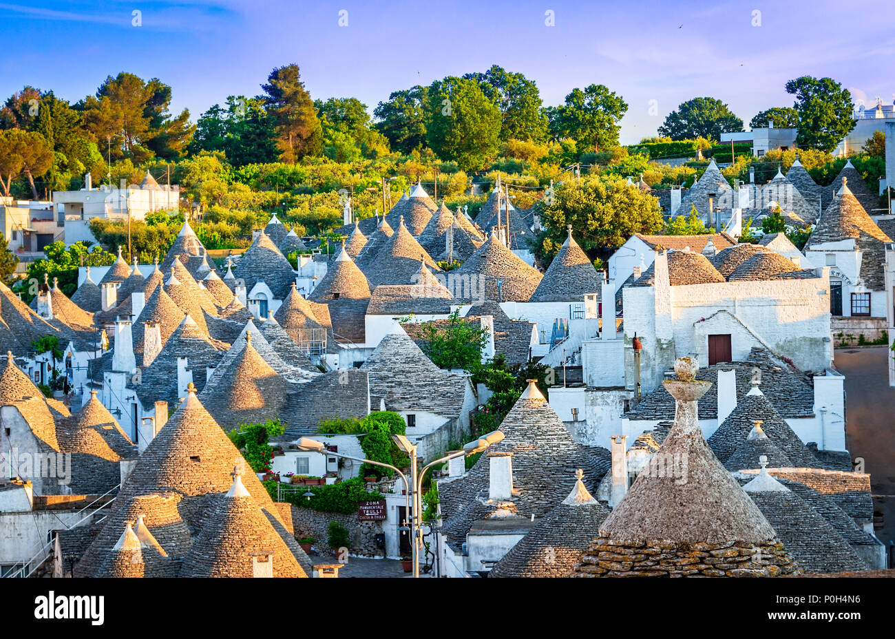 Alberobello, Puglia, Italy: Cityscape over the traditional roofs of the Trulli, original and old houses of this region, Apulia Stock Photo