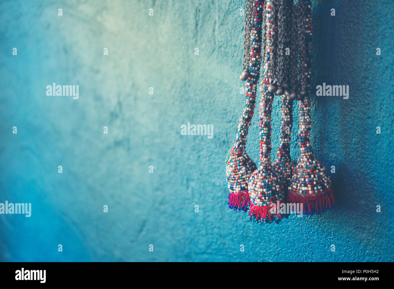 Blue wall background with knitting yarn Stock Photo
