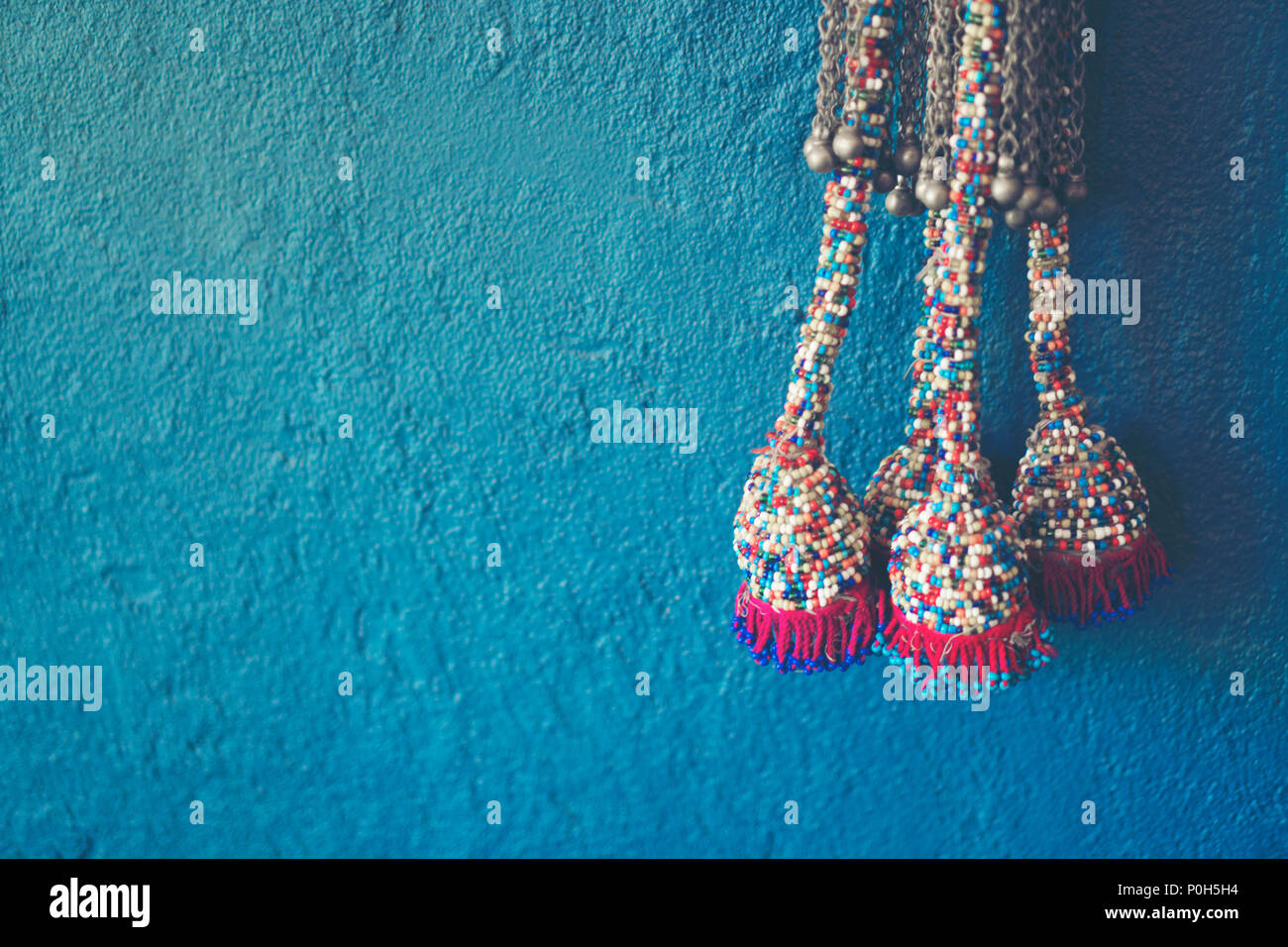 Blue wall background with knitting yarn Stock Photo