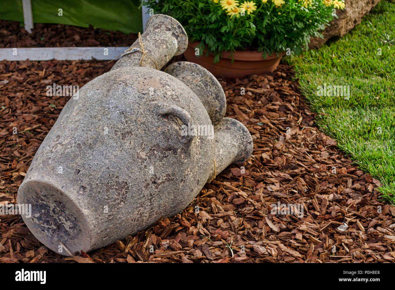 Closeup of ancient amphora in the street in the morning Stock Photo - Alamy