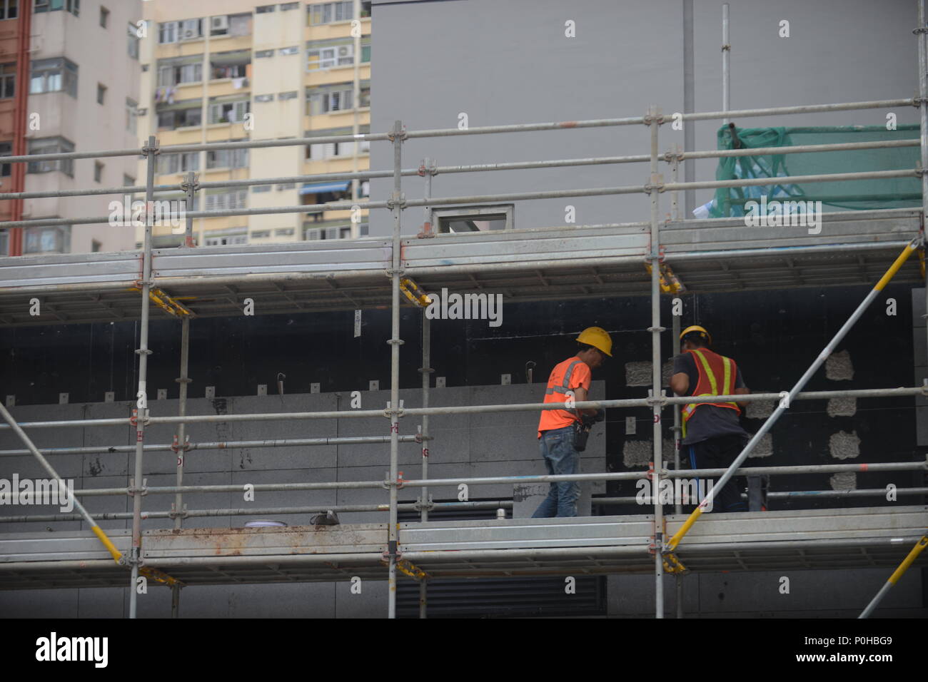 A photo showing a worker working in the construction site of the Sha