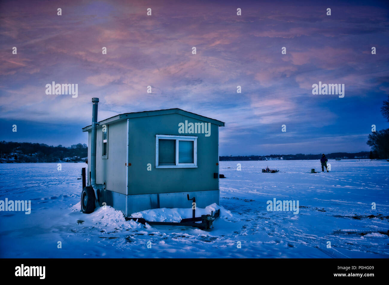 An ice fishing shack locked into the ice on a Twin Cities lake