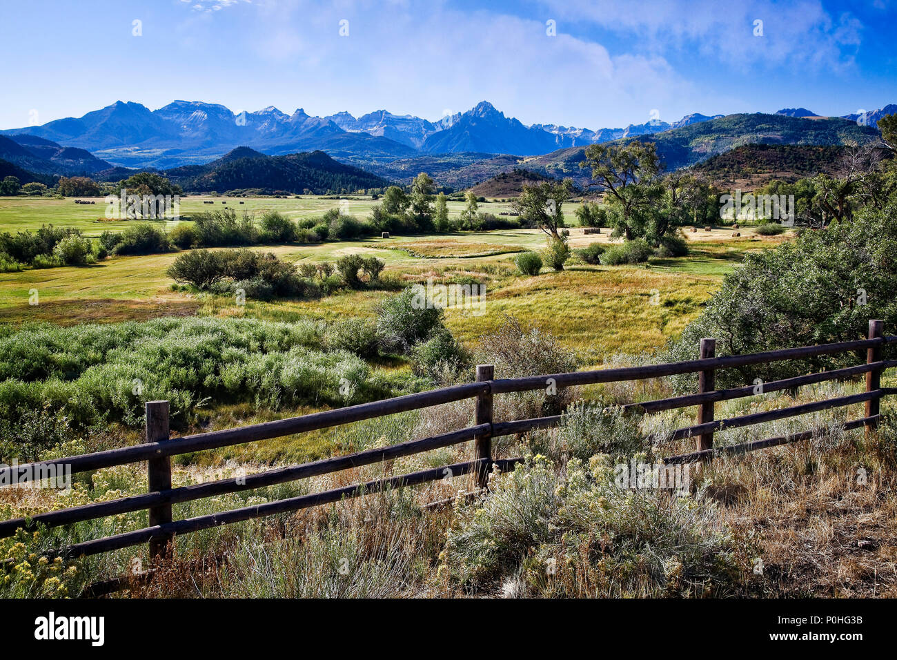 Ranches lead up to the San Juan Mountains in Colorado, USA. Stock Photo