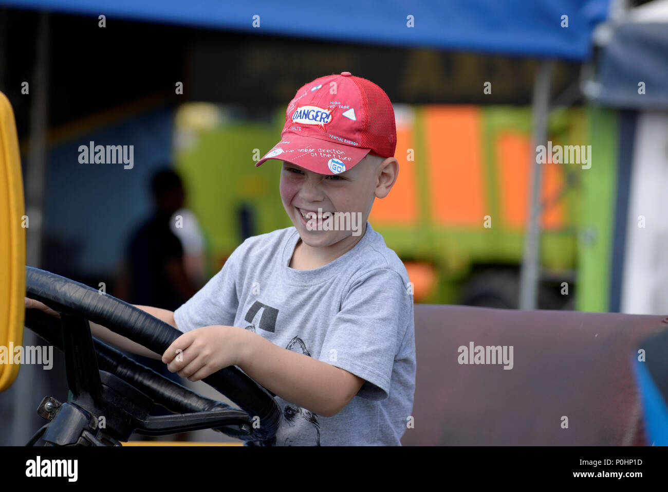 Minsk Belarus 9 June 2018 Children Play On Exhibited Samples Of Old Agricultural Machinery During The 28th International Specialized Exhibition Belagro Near The Village Schomyslitsa Some 5 Km From Minsk Belarus 09