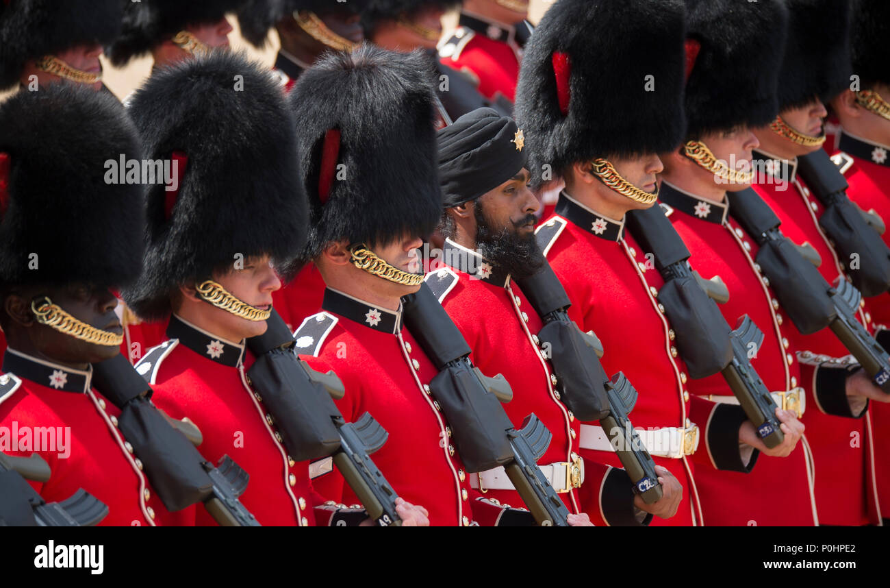 Horse Guards Parade, London, UK. 9 June, 2018. The world famous Queen’s Birthday Parade, also known as Trooping the Colour, takes place with The Coldstream Guards Trooping their Colour in front of HM The Queen and an audience of over 7,500 guests at Horse Guards in hot sunshine. Guardsman Charanpreet Singh Lall is the first soldier to wear a turban on the historic parade. Credit: Malcolm Park/Alamy Live News. Stock Photo