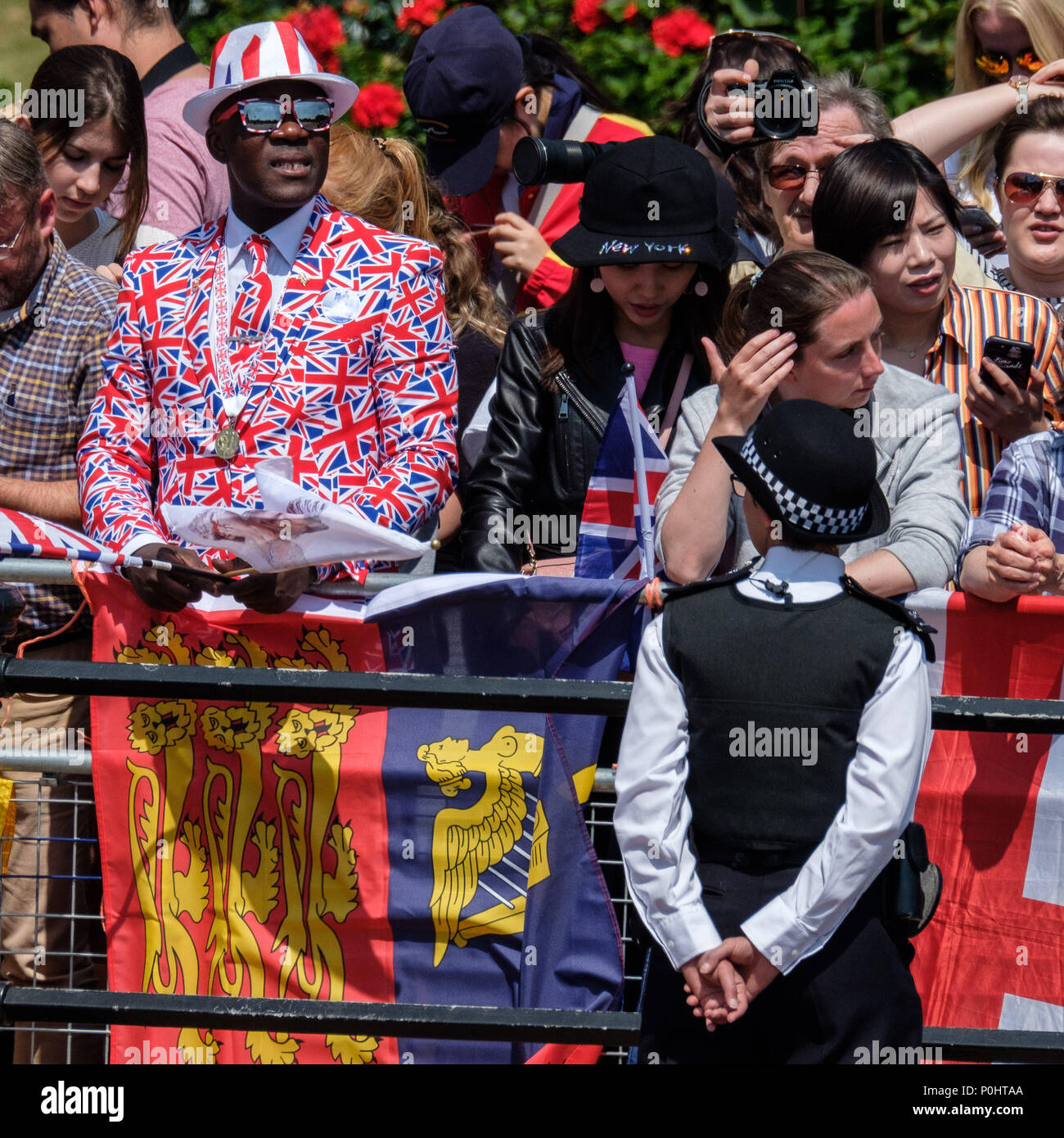 Crowds gather on the Mall for Trooping the Colour and Queens Birthday Parade on Saturday 9 June 2018 in Buckingham Palace , London. Pictured: A spectator in a union jack suit. Picture by Julie Edwards. Credit: Julie Edwards/Alamy Live News Stock Photo