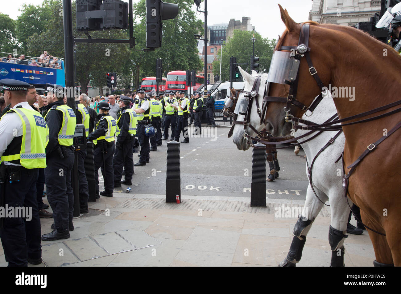 London UK 9th June 2018 Police stand guard as protesters gathered in London to demand the release of English Defense League co-founder Tommy Robinson. Credit: Thabo Jaiyesimi/Alamy Live News Stock Photo