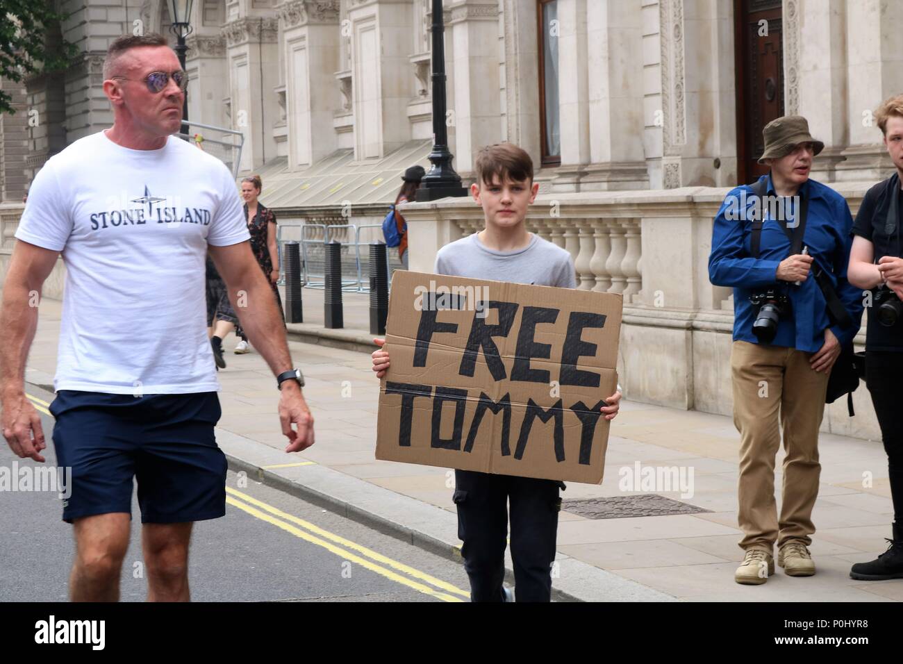 London, UK. 9th June 2018. Free Tommy Robinson March in London, UK with  thousands of people marching and waving flags and plaques, police also in  attendance at this event with riot wear.
