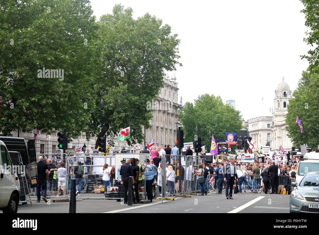 London, UK. 9th June 2018. Free Tommy Robinson March in London, UK with thousands of people marching and waving flags and plaques, police also in attendance at this event with riot wear. Credit: Michelle Bridges/Alamy Live News Stock Photo