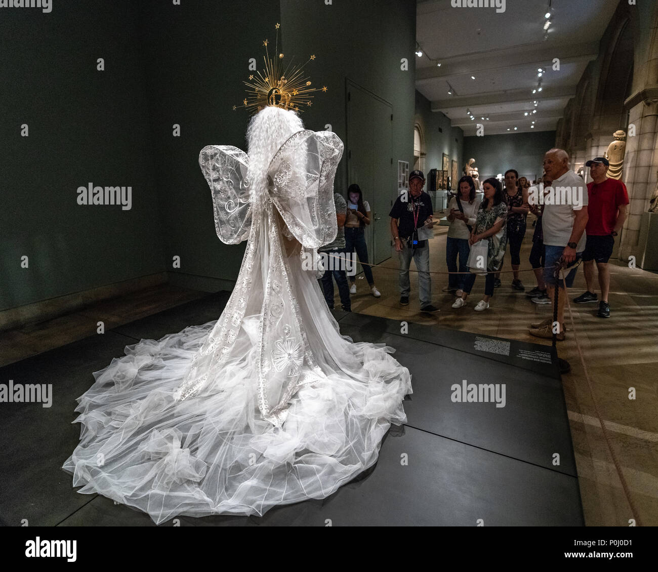 New York, USA. 9th June 2018. NEW YORK, USA, 9 June 2018. 'Madonna' Wedding ensemble designed by John Galliano for the House of Dior on display at the Metropolitan Museum of Art for the 'Heavenly Bodies' exhibition. This ensemble is made of white silk tulle, embroidered white silk and metal thread.  Photo by Enrique Shore Credit: Enrique Shore/Alamy Live News Stock Photo