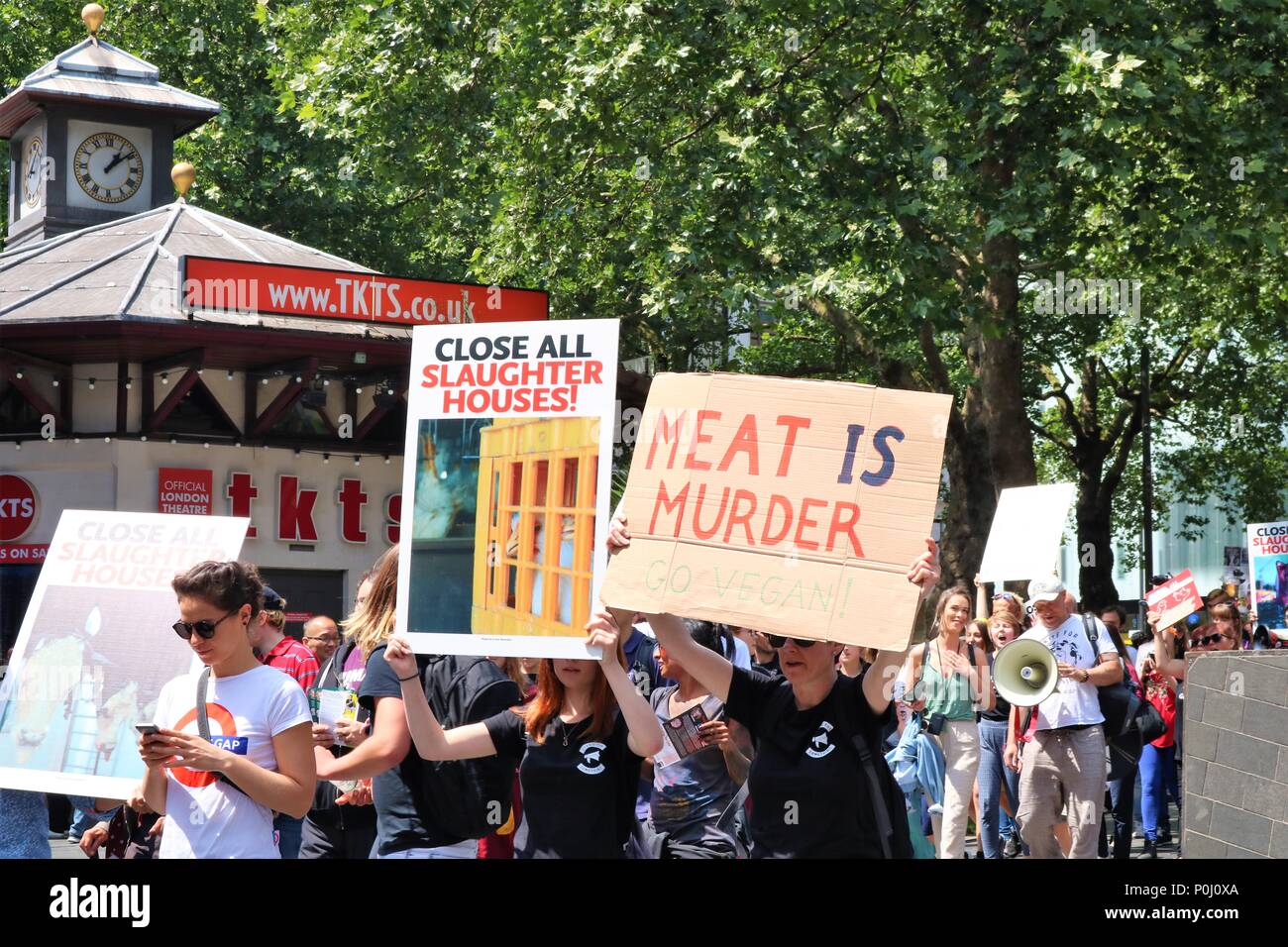 London, UK. 9th June 2018. Small protest march at Leicester Square, London, UK  - Vegans against animals for meat, people waving banners including 'Close All Slaughter House' Credit: Michelle Bridges/Alamy Live News Stock Photo