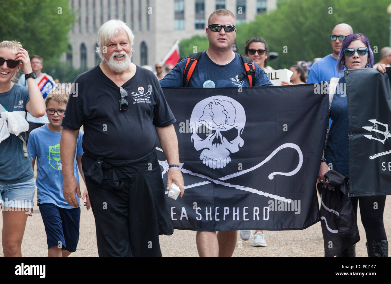 Watson, left, founder of Sea Shepherd, marches with supporters on the March For The Ocean in Washington, D.C., June 9, 2018. The inaugural March for the Ocean called attention to ocean issues including plastic pollution and overfishing at events in the U.S. Capital and around the United States.. Credit: Robert Meyers/Alamy Live News Stock Photo