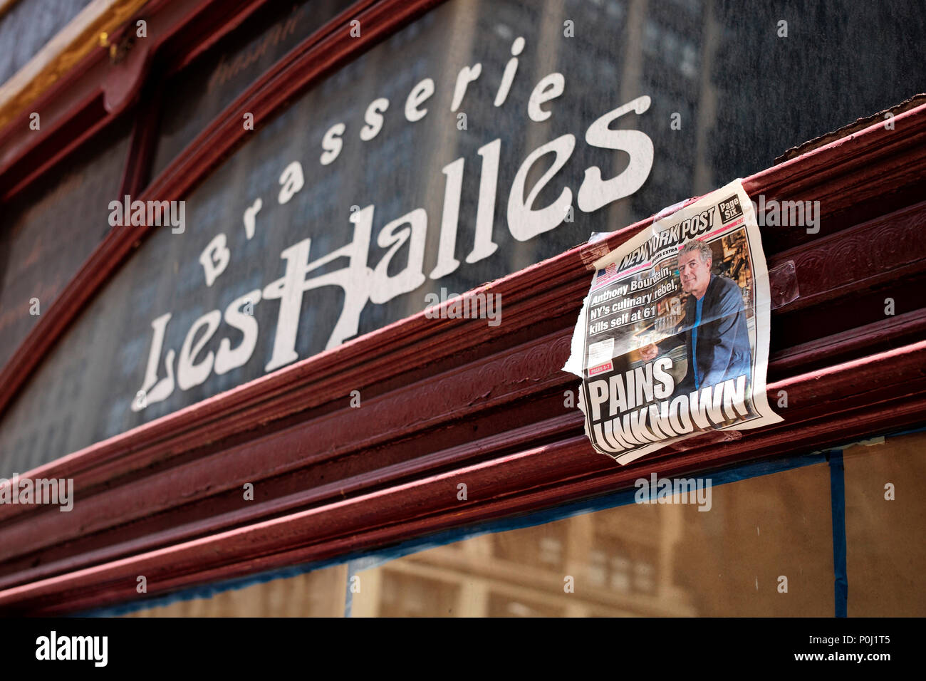 New York, USA. 9th June, 2018. A page of New York Post showing a report of renowned U.S. chef and television personality Anthony Bourdain's death is seen at the closed location of Brasserie Les Halles, where Bourdain used to work as the executive chef, in New York, the United States, on June 9, 2018. Anthony Bourdain was found dead Friday in France at the age of 61. Credit: Li Muzi/Xinhua/Alamy Live News Stock Photo