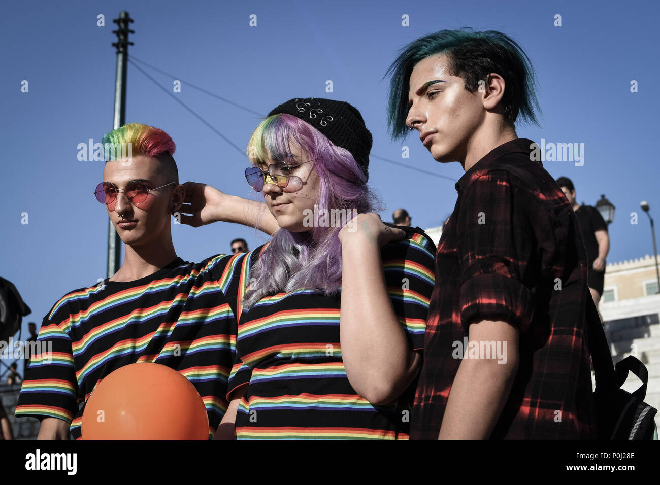 Athens, Greece. 9th June 2018. Three participates seen at the pride festival.  year's Pride theme was discrimination against women, with transnational women receiving lasting and unstoppable marginalization and violence. Credit: SOPA Images Limited/Alamy Live News Stock Photo