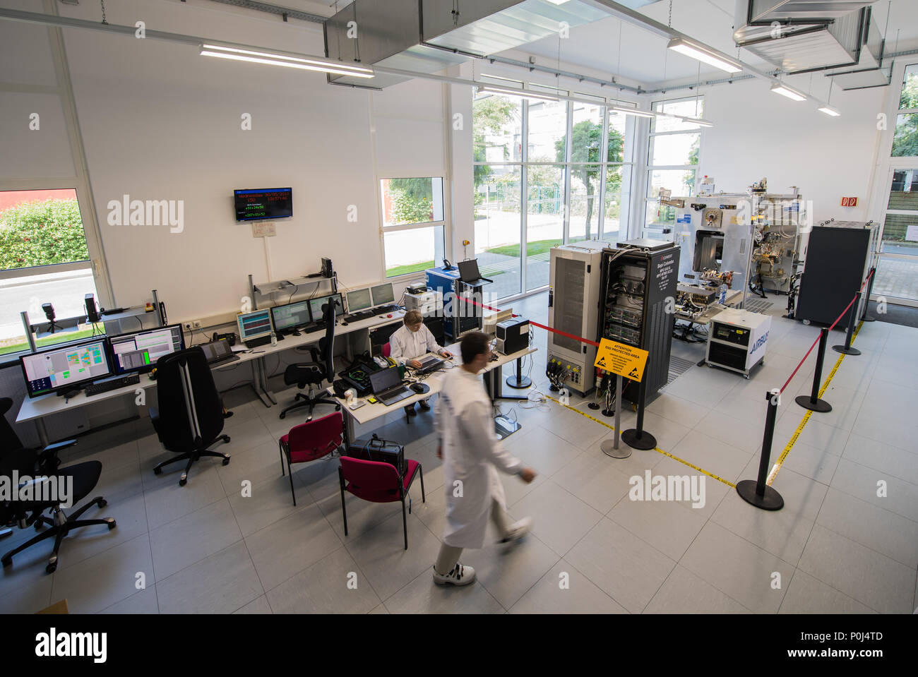 30 May 2018, Germany, Darmstadt: Karel Kotarowski, Airbus engineer, walking into the space probe's closed-off assembly area. 'BepiColombo' is a space probe and its flight to Mercury is planned for October 2018. The mission is a cooperation between ESA and the Japanese space administration JAXA. The probe is to reach the orbit of Mercury in 2025. Photo: Andreas Arnold/dpa Stock Photo