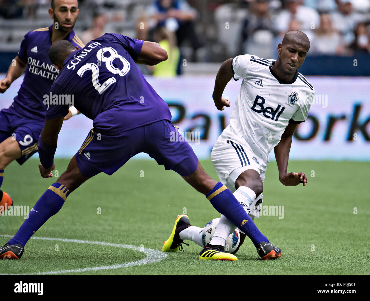 Vancouver. 10th June, 2018. Aly Ghazal (R) of Vancouver Whitecaps vies with Chris Schuler of Orlando City SC during a regular season MLS match at BC Place in Vancouver, June, 9, 2018. The Vancouver Whitecaps won 5-2. Credit: Andrew Soong/Xinhua/Alamy Live News Stock Photo