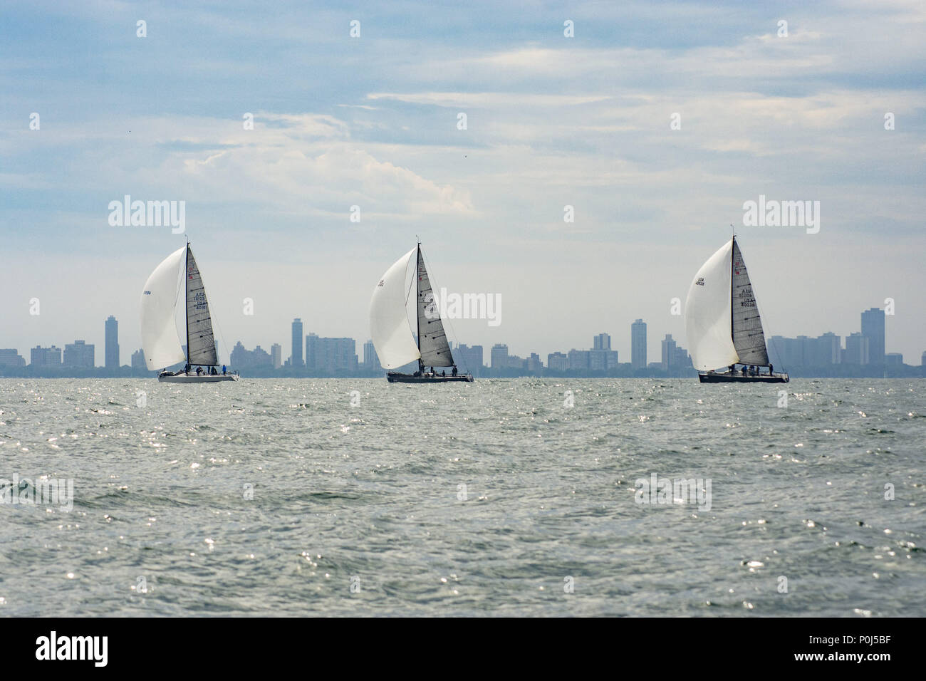 Chicago, IL, USA. 8th June, 2018. The National Offshore One Design 2018 regatta takes place in Chicago from June 8 to June 10. Yachtsmen on more than a 100 boats gather to test their sailling knowledge against each other. There are 3 circles of different fleets racing . On Saturday, some of the boats go on a long distance race while the others race around the marks set up by the race committee. Helly Hansen (clothingwear) is the principal sponsor. The races are organized by Sailing World Magazine with the Chicago Yacht Club acting as host for the event. (Credit Image: © Karen I. Hirsch Stock Photo