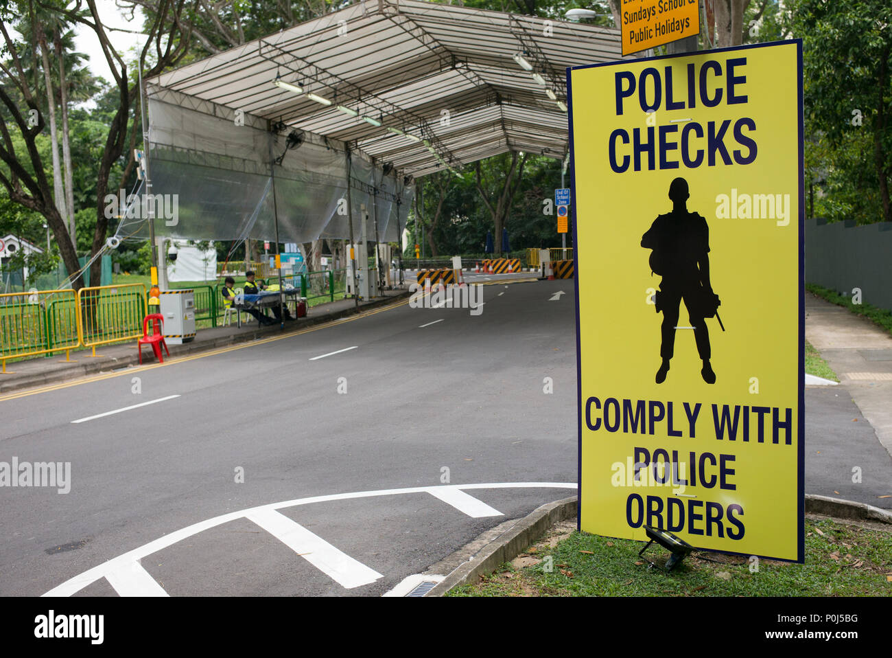 Singapore. 10 June, 2018.  Security checks in the process of being set up ahead of Donald Trump's visit to Singapore for his summit with Kim Jong-un.  This area, Anderson Road, leads to the wing of the Shangrila Hotel where Trump will be staying during his visit. Credit: Richard Coulstock/Alamy Live News Stock Photo