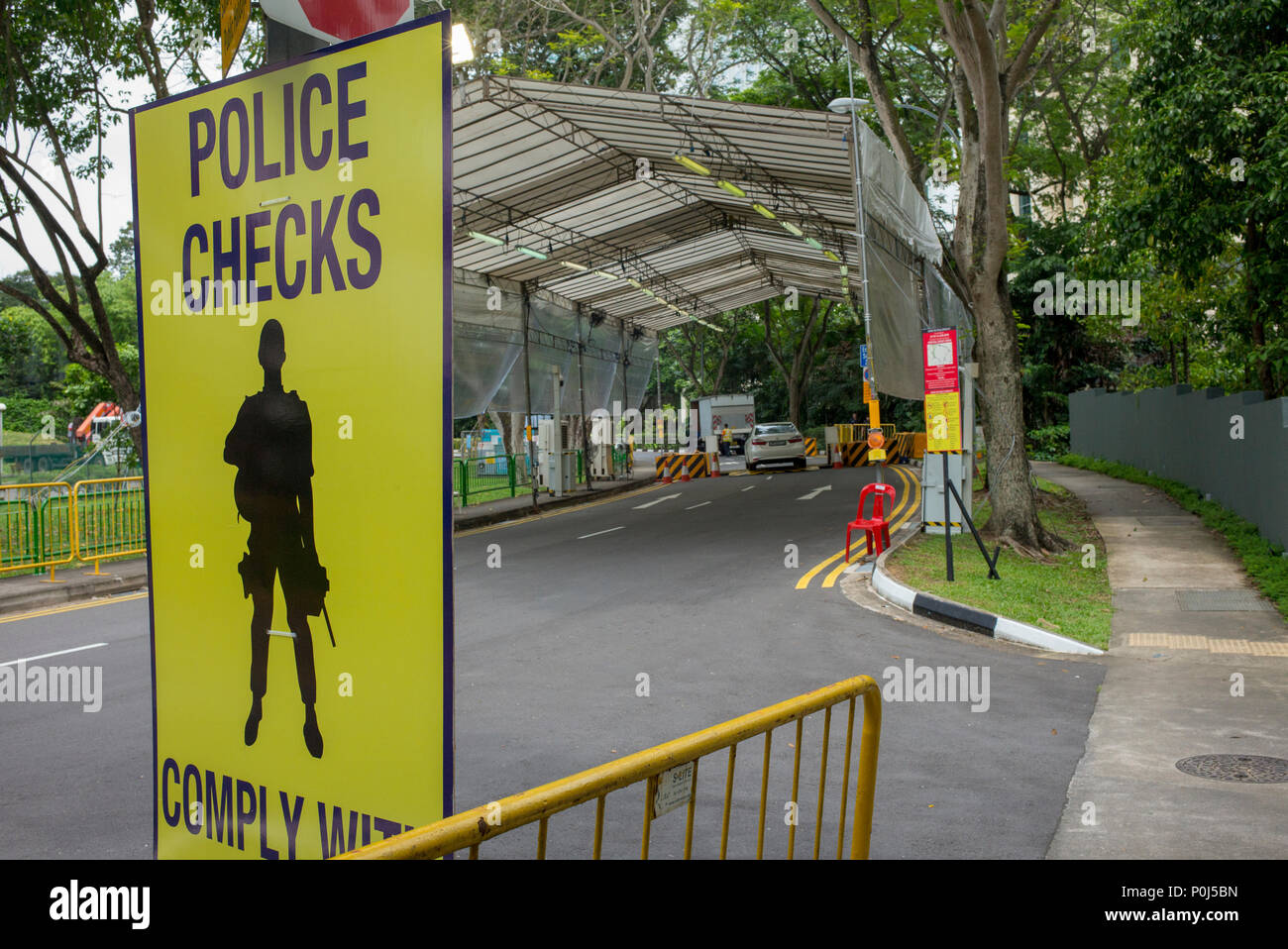 Singapore. 10 June, 2018. Security checks in the process of being set up ahead of Donald Trump's visit to Singapore for his summit with Kim Jong-un.  This area, Anderson Road, leads to the wing of the Shangrila Hotel where Trump will be staying during his visit. Credit: Richard Coulstock/Alamy Live News Stock Photo