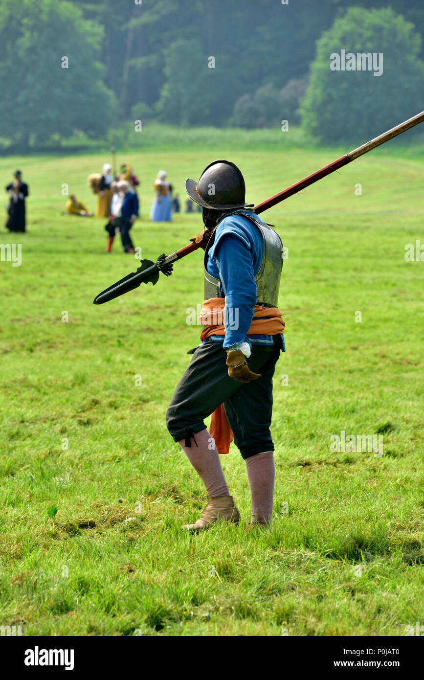 Lone 17th century military pikeman carrying his pike (spear) in Sealed Knot English Civil war battle, UK Stock Photo