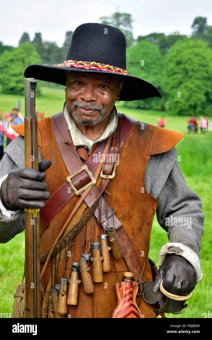 Portrait of 17th century musketeer in costume with musket in English Civil war re-enactment Stock Photo