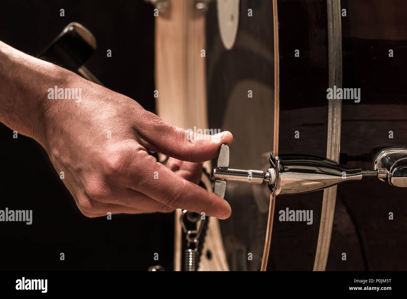 man adjusts percussion instruments, creative music concept Stock Photo ...