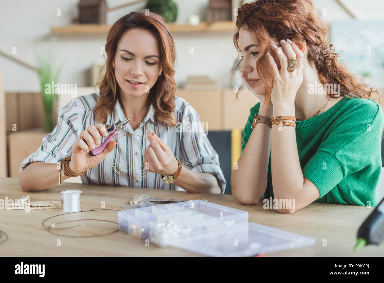 concentrated young women making accessories at Stock Photo Alamy