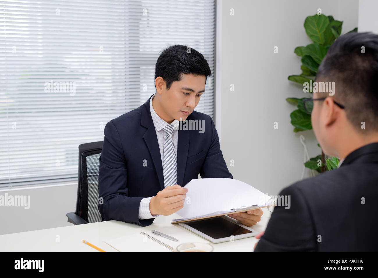 job interview of two business professionals greeting new business interview