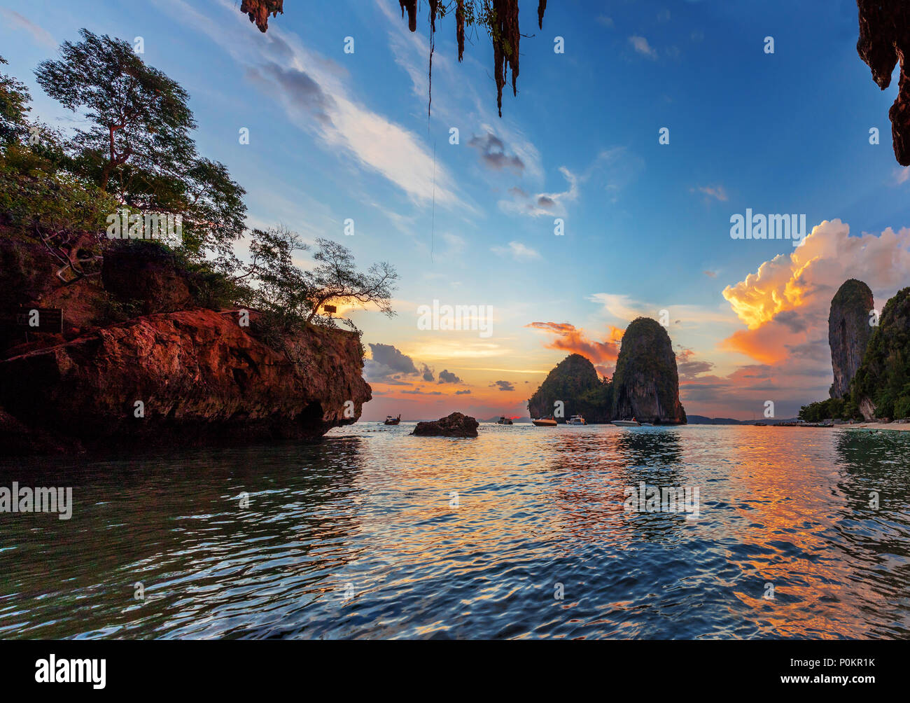 Popular travel tropical karst rocks perfect for climbing Phra Nang Cave Beach in sunset, Krabi province, Thailand Stock Photo