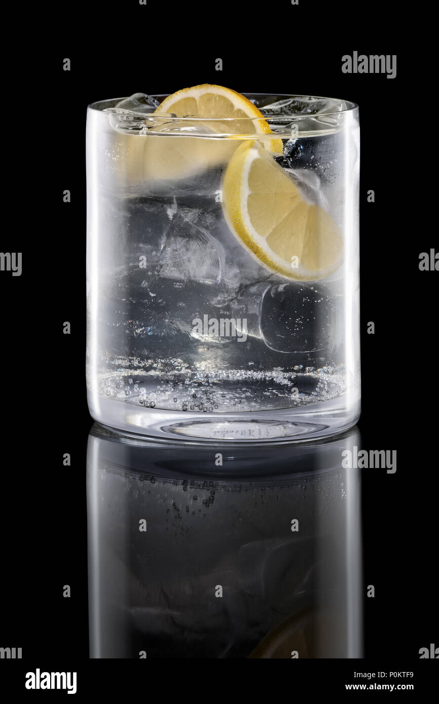 Gin and tonic in Rocks glass isolated on black Stock Photo Alamy