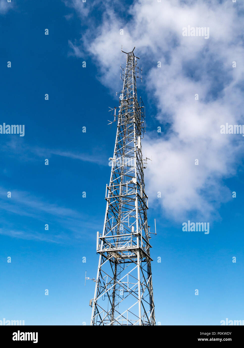 Transmitter radio tv phone mast on the summit of Snaefell, Isle of Man, UK Stock Photo