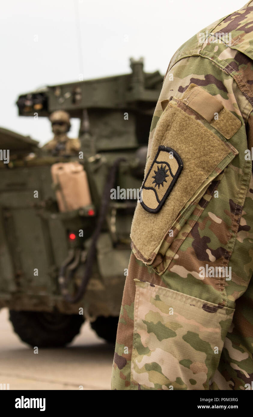 U.S. Army Reserve transportation coordinators with 1172nd Movement Control Team, 446th Transportation Battalion (Movement Control), observe the arrival of a convoy from 3rd Squadron, 2d Cavalry Regiment, before getting their counts during Saber Strike 18 at Powidz Air Base, Poland, June 2. Saber Strike is a long-standing U.S. Army Europe-led integrated training exercise that helps facilitate cooperation amongst the U.S., Estonia, Latvia, Lithuania, Poland and 19 other allied and partner nations June 3-15 (U.S. Army Reserve photo by Spc. Daisy Zimmer, 221st Public Affairs Detachment). Stock Photo