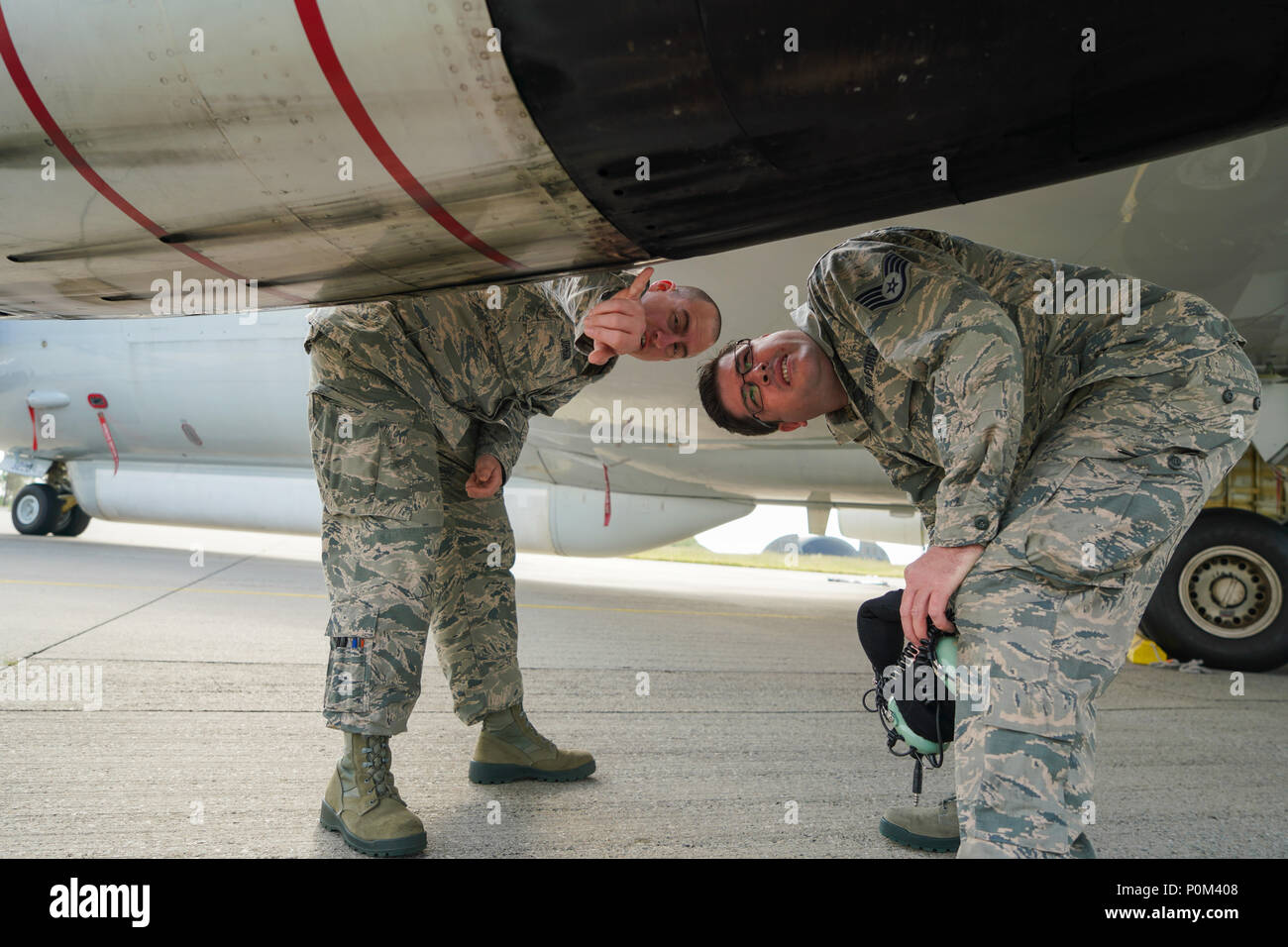 U.S. Air Force Tech. Sgt. Joshua Johnson, left, and Staff Sgt. Paul Barber, both jet engine mechanics with the 116th Air Control Wing (ACW), Georgia Air National Guard, Robins Air Force Base, Georgia, inspect the thrust reverser on an E-8C Joint STARS at Fighter Wing Skrydstrup, Denmark, June 4, 2018. The JSTARS team consists of the Georgia Air National Guard’s 116th ACW, plus active duty personnel assigned to the 461st ACW and Army JSTARS. They are in Denmark to participate in Exercise Baltic Operations, or BALTOPS, June 4-15 and Saber Strike 18 from June 3-15. JSTARS brings a unique, manned, Stock Photo